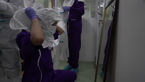 covid-19 healthcare workers using ppe protective equipment. nurse or doctor theme preparing for virus treatment.
