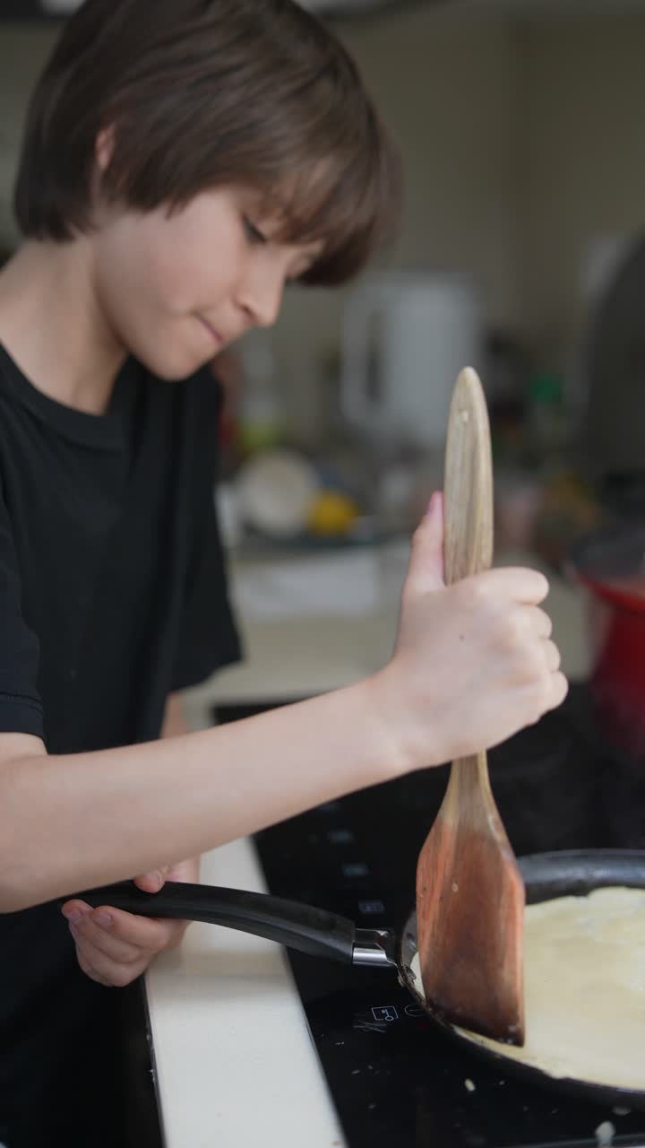 Boy Cooking Pancakes