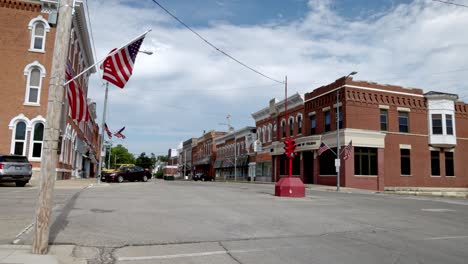 antique four way stop light in downtown toledo, iowa with stable video wide shot at an angle