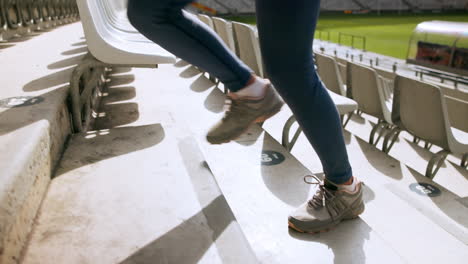 person running up stadium steps