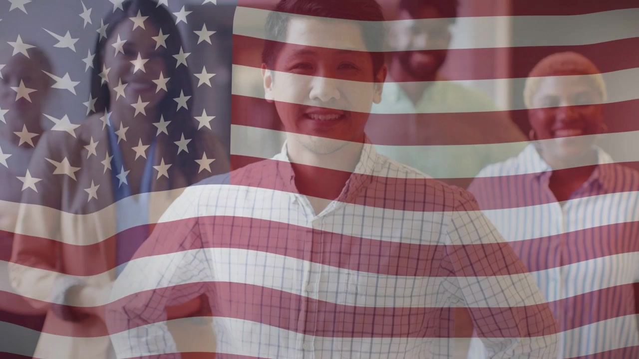 Business team posing as clip playing, US flag overlay drifting, emphasizing center man smiling