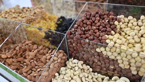 dry fruit and nuts are displayed during the gulf food exhibition, united arab emirates