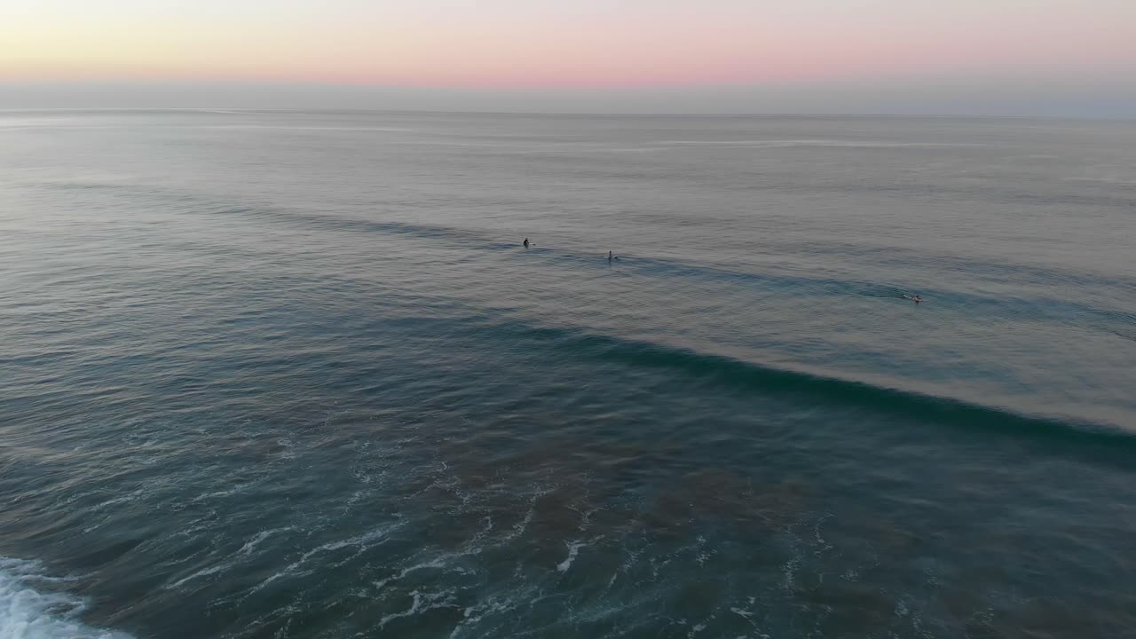 Tourist Enjoy Surfing On The Famous Costa Rica Beach During Sunset -  Perfect For Summer Activities - Aerial shot
