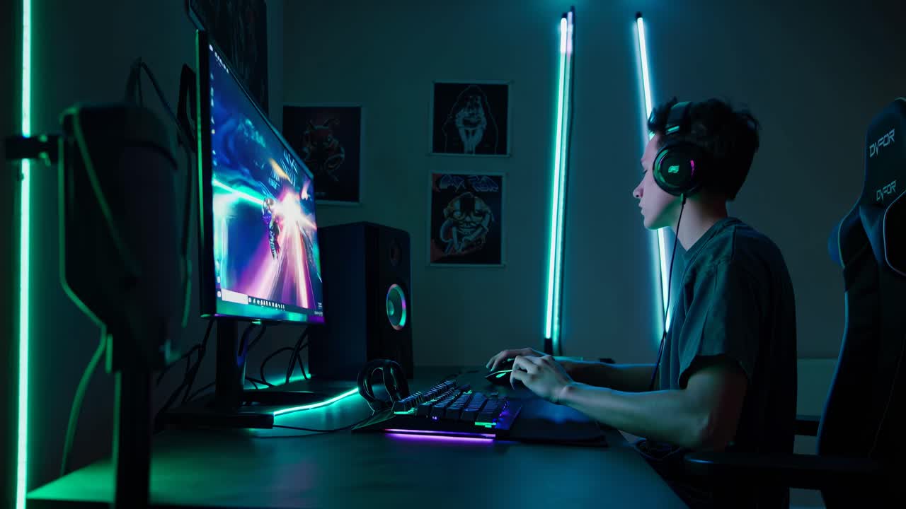 Side angle shot of a gamer in a neon-lit room, focused on a video game