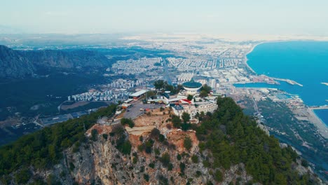 Aerial-4K-drone-video-of-a-Tunektepe-Teleferik
Cable-station-positioned-on-top-of-the-hill-with-the-mountains-in-the-background