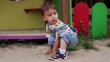 cute baby boy playing in a playground
