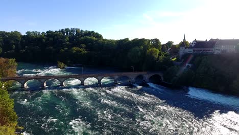 train goes over bridge above the rhine falls