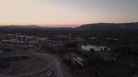 urban 4k drone shot of highway off-ramp and salt lake valley