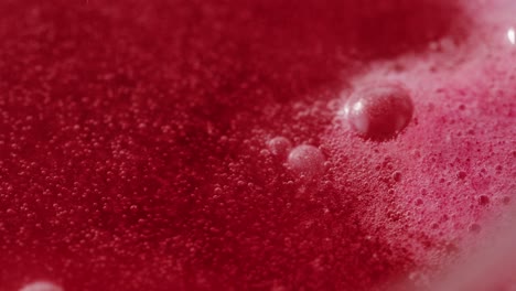 red liquid with bubbles