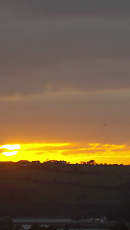 sun in the morning rising over the fields