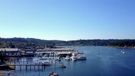 slow descending aerial shot pushing towards full marina in gig habor, washingon, usa