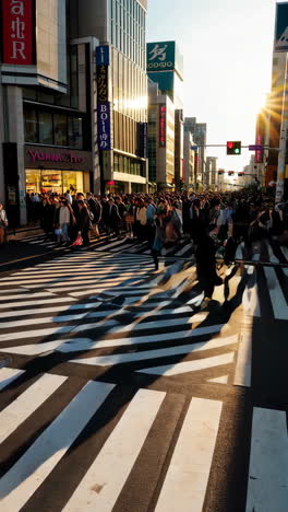 bustling crowd of pedestrians crossing a street in tokyo