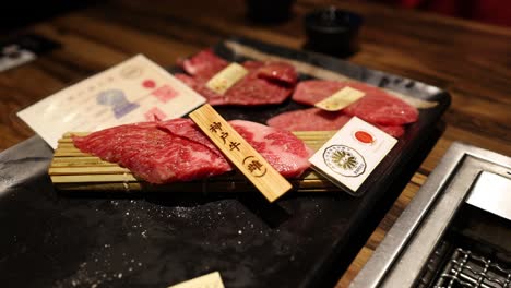 chef precisely cuts high-quality beef on cutting board.