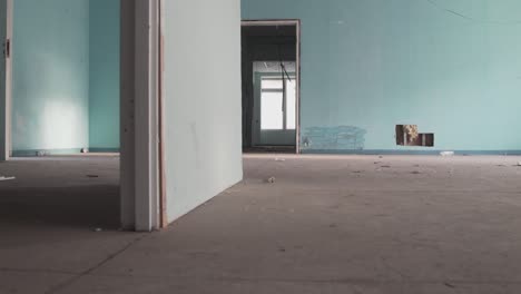 abandoned office room with holes in the wall