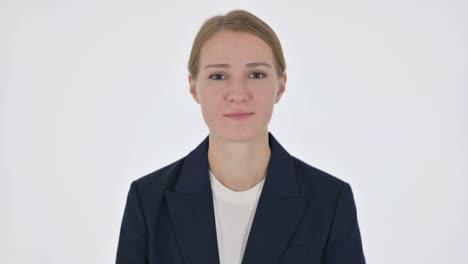 young businesswoman pointing at the camera on white background