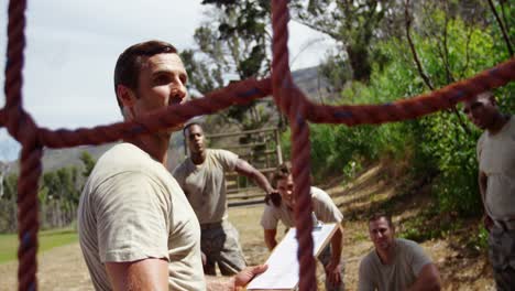 male trainer giving instruction to military soldiers 4k