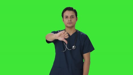 Disappointed-Indian-doctor-showing-thumbs-down-Green-screen