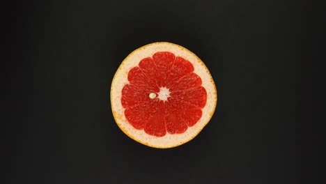 round fresh juicy sliced slices of citrus grapefruit rotate. the concept of healthy eating