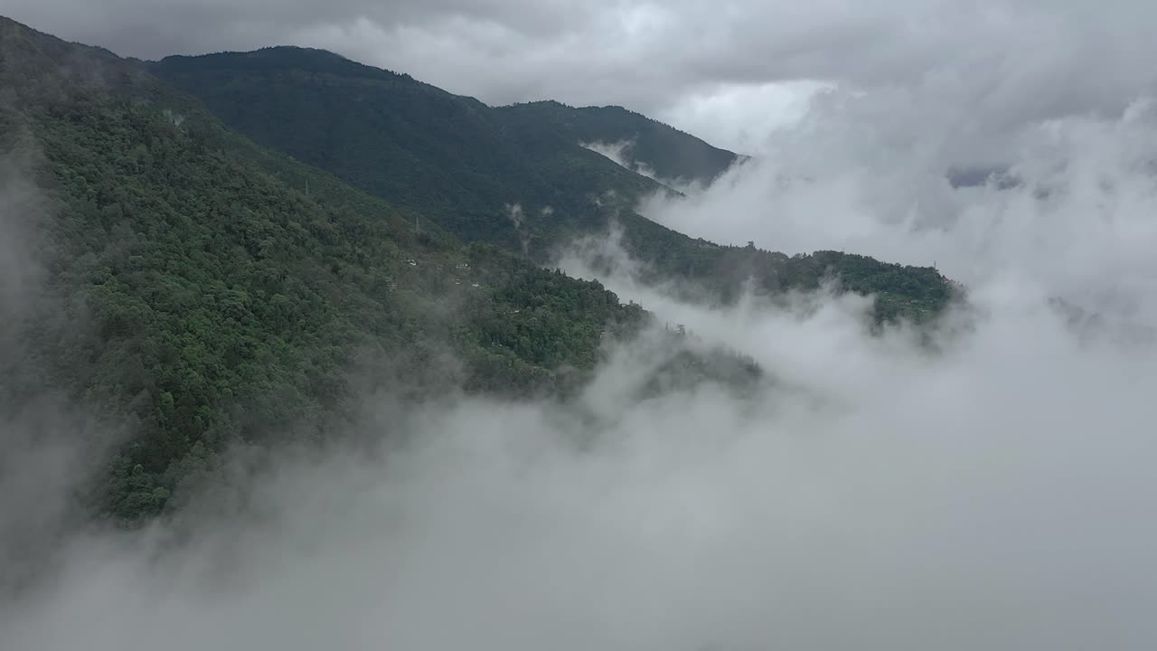 mountain landscape with clouds and fog, Established Aerial shot