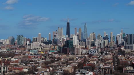 aerial boom shot reveals chicago skyscrapers and skyline. drone shot