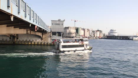 boat passing under a bridge in istanbul