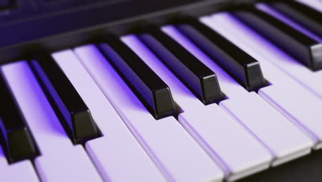 top view of the keys of a synthesizer keyboard, moving