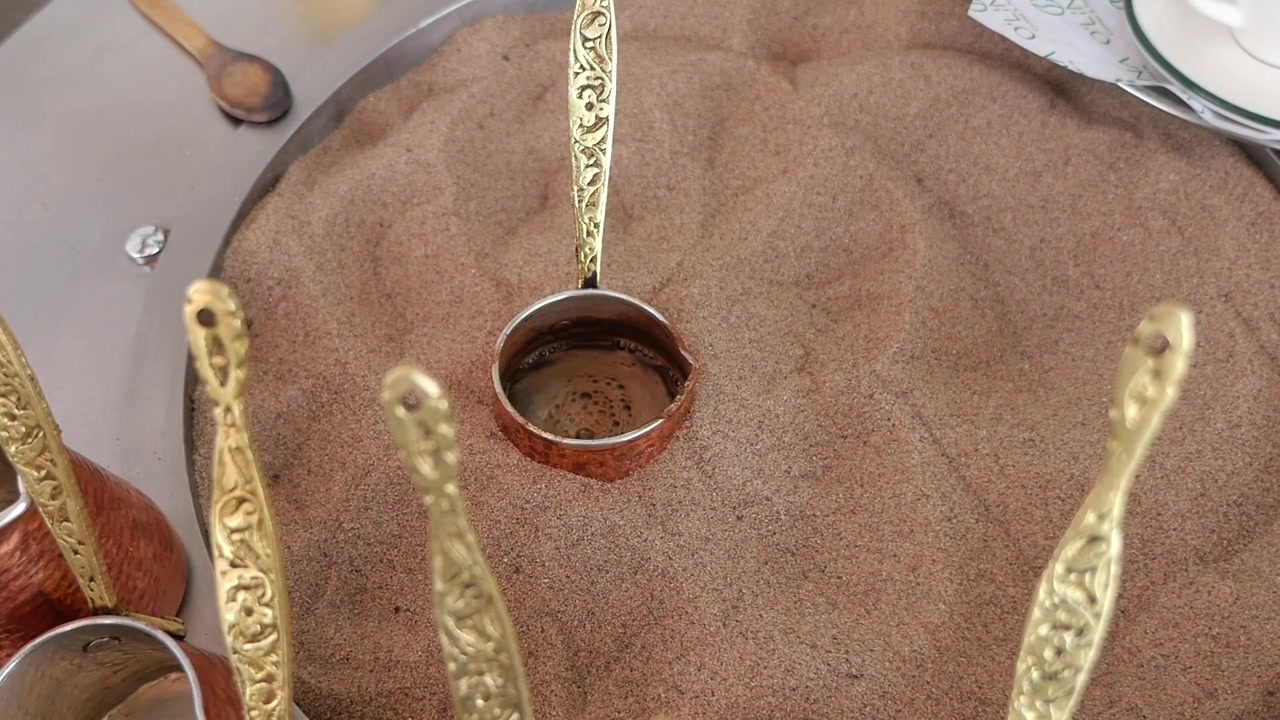 Traditional Turkish Coffee Brewing in Hot Sand