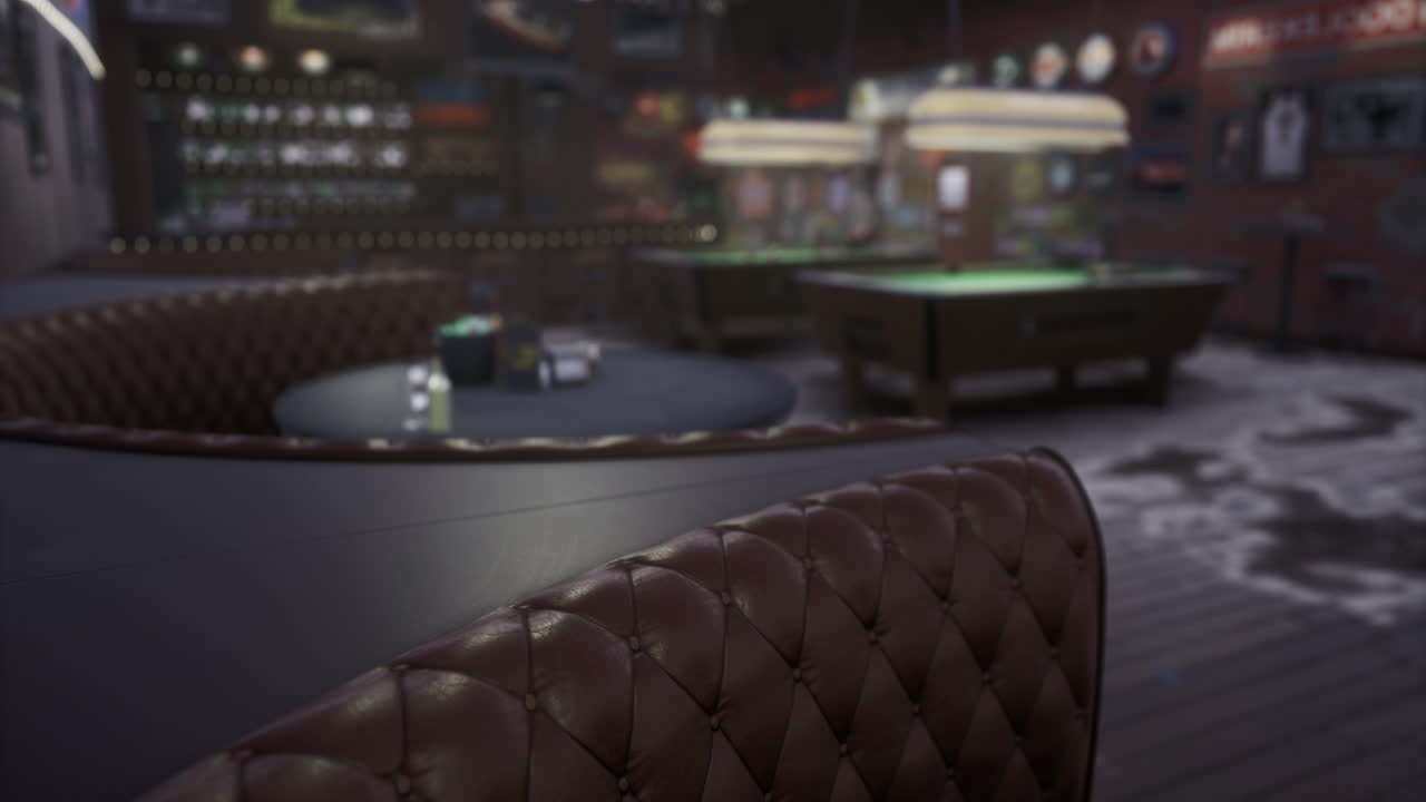 Cozy game room with plush seating and pool tables under soft lighting