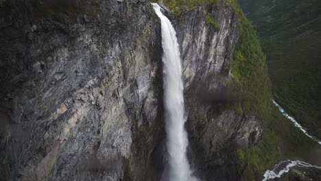 majestic waterfall cascading down a cliffside in norway
