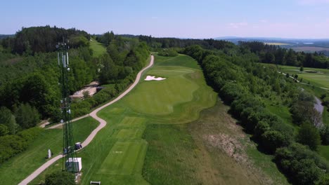 aerial drone view of antenna or transmitter near golf course in kacov, czech republic