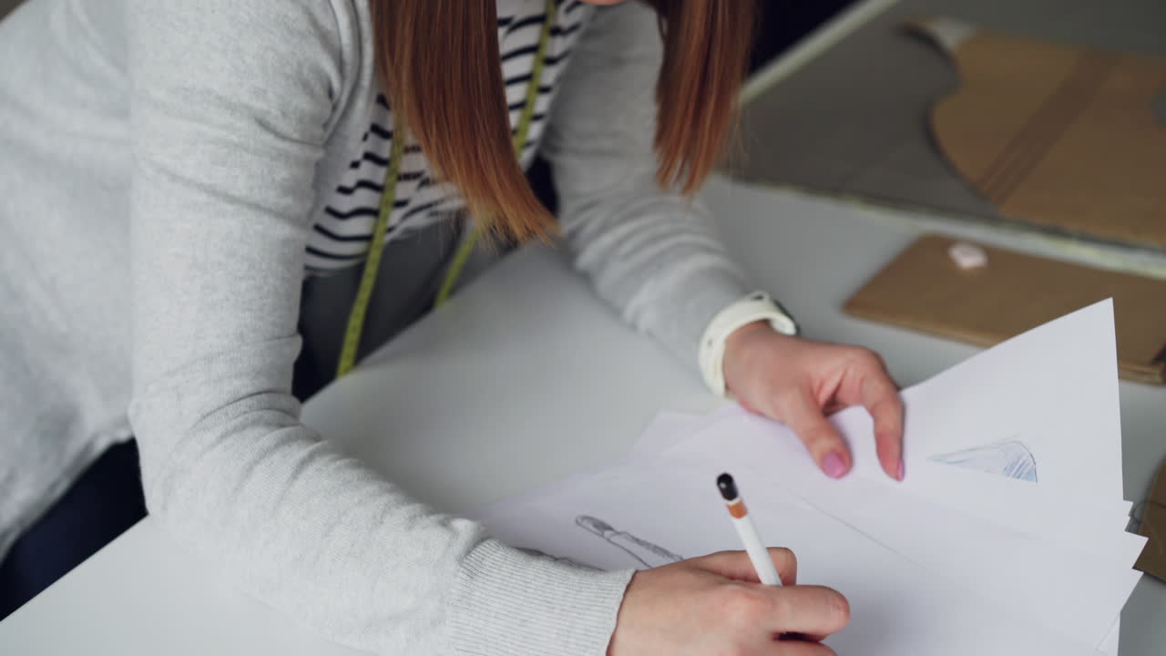 Fashion Designer Working on Patterns