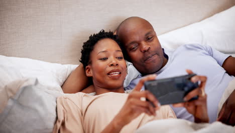 Home,-bed-and-black-couple-with-a-cellphone