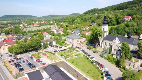 aerial view of a picturesque town with a prominent church and surrounding landscape