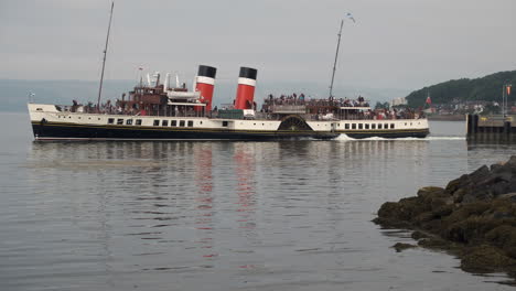 the ps waverley a paddle steamer sailing in the waters from largs in scotland, uk