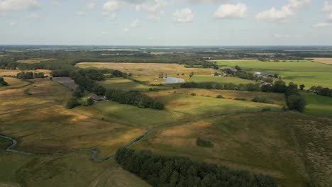 aerial view of dutch countryside landscape with fields, forests and water features