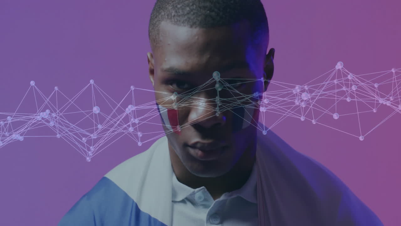 Man standing against purple backdrop, displaying semi-transparent network overlay for technology