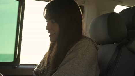 Traveling-woman-working-on-laptop-in-van