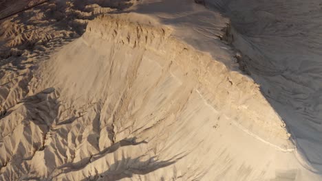 aerial view of a desert landscape with canyon and mountain formations