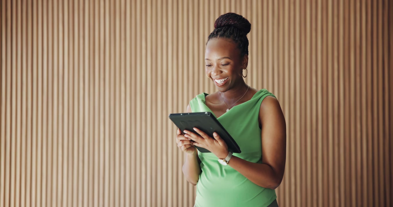 Smiling Professional Woman Using Tablet in Modern Office