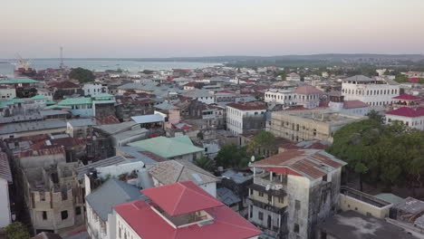 low aerial over islamic mosque in historic stone town in zanzibar