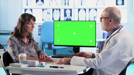 senior woman arriving at appointment with physician next to mockup screen