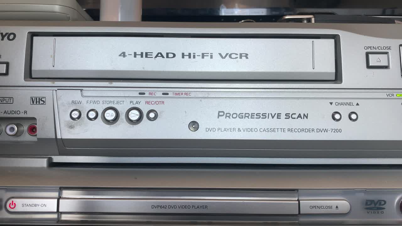 Home Video VHS Tape being loaded and ejected from VCR 1990s