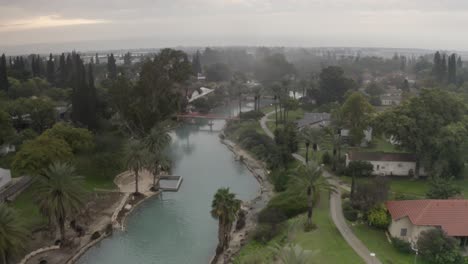 aerial view of a tranquil river flowing through a residential area