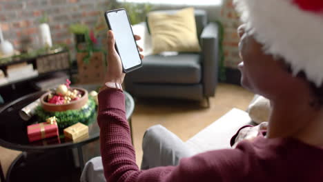 Happy-african-american-man-using-smartphone-with-copy-space-for-video-call-at-home,-slow-motion