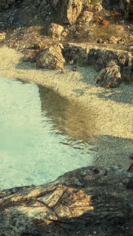 a beautiful beach with clear blue water and sandy shores