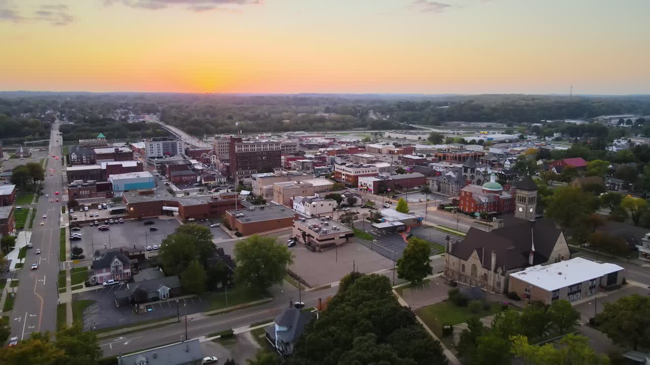 Aerial view of downtown Massillon, Ohio at sunset featuring historic buildings and streets. Dolly Forward Sunset W