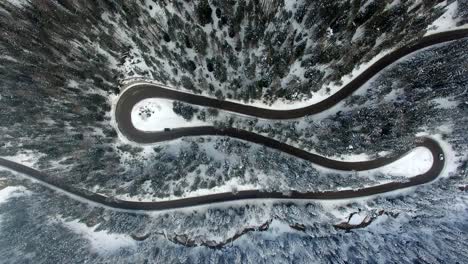 AERIAL:-Road-in-Forest-with-snow-in-Dolomites