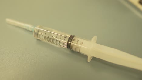 close view of 10 ml plastic transparent syringe with drug medication within for patient treatment in hospital