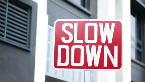 Close up of slow down sign against building ,