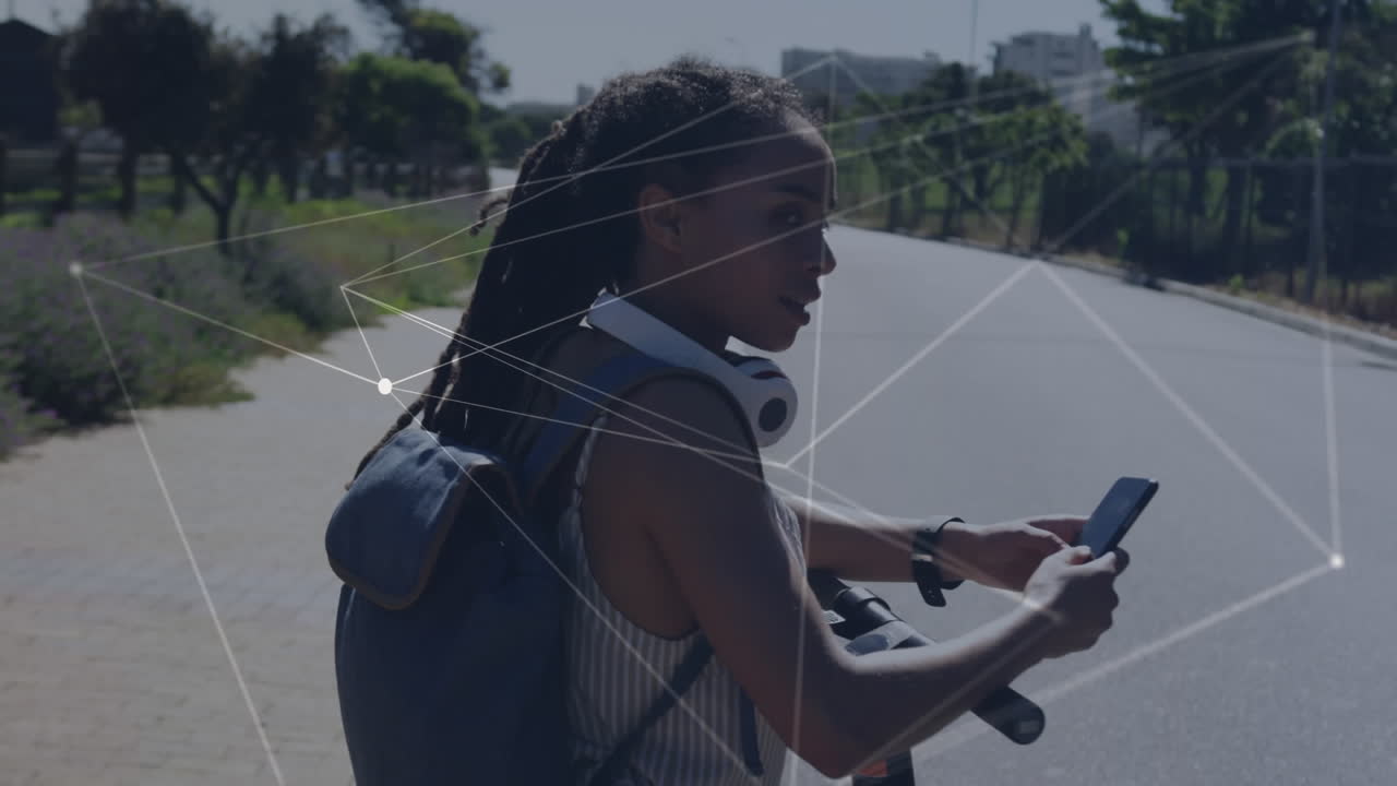 Animation of network of connections over woman using smartwatch standing on her scooter